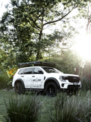 The Lucas Creek D-Luxe aluminium hard shell roof top tent closed on the top of the Lucas Creek Ford Everest
in and outdoor setting